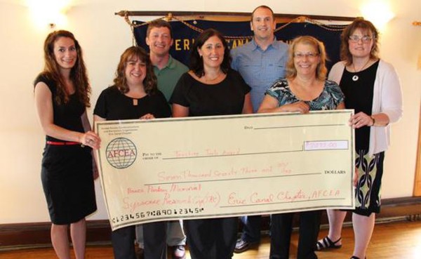 Teaching Tool award recipients in May are (front row, l-r) Lauren Vollmer of Rome Catholic School; Lisa Smithling of Sauquoit Valley Elementary School; Karla Williams of Whitesboro High School; Patricia Metzger of Utica City School District; (back row, l-r) Travis Hall of Solvay Union Free School District; Eric Wojtalewski of Solvay High School; and Anne Huntress of South Lewis Central School. Not pictured is Michael Comet of South Lewis Central School.