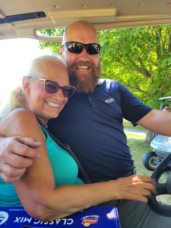 In August, Adam Hovak and Chris Garlen give the camera a smile during their day of golfing. 