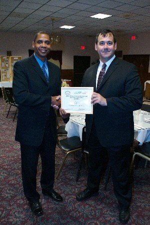 David Ferris (r), civilian engineer, Information Fusion Technology branch, Air Force Research Laboratory, receives the Excellence in Leadership and Humanitarianism Award from Rick Lockridge, chapter president, at the Mohawk Valley Executive Engineering Council's 59th Annual Engineers Banquet, held in February.