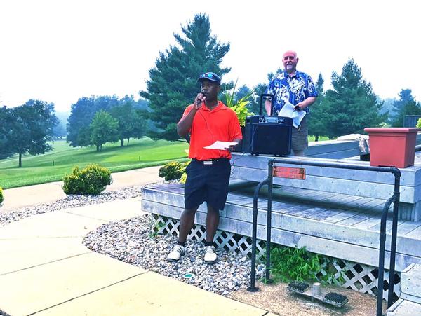 Derek Massey, chapter vice president of programs (front l), and Michael Tague, chapter treasurer, kick off the September event.