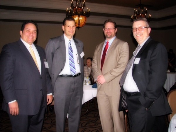 Gathering at the chapter's March general membership meeting are (from l) Executive Vice President Miguel Rivera; Vice Chairman Mark Thompson; guest speaker Donald W. Hewatt of DXC Technology; and Chapter President Bill Heidenreich.