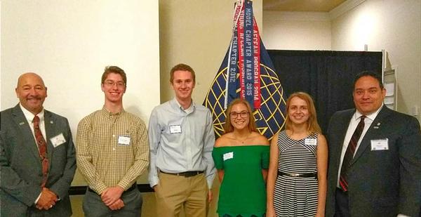Martin Harbolt, the chapter's board chairman (l), and Miguel Rivera, chapter president (r), award Lift Off Scholarships in July to (from 2nd from l) Thomas Hutto, Brian Knapp, Keeley Slade and Ekaterina Kovatsenko.