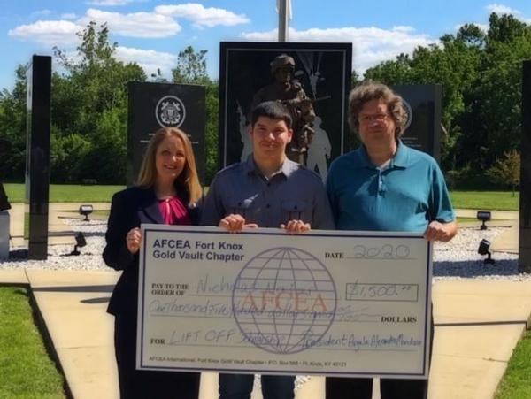 In July, Chapter President Angela Alexander-Mendoza (l) and Chapter Executive Vice President Richard Roda (far r) present Nicholas Najar, biology major at Murray State University, with a scholarship check.