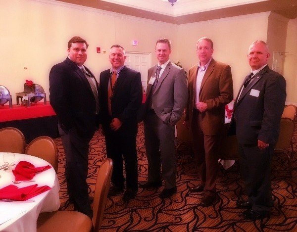 Representing December event sponsor Booz Allen Hamilton are company representatives (l-r) Mike Tharpe, Kevin Payne, Chad Gardiner, Rob Robertson and Jake Rowlett.