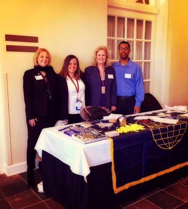 Greeting March meeting attendees are (from l) Chapter Secretary Angela Alexander-Mendoza; Vice President of Awards Jeni Spencer; Vice President of Women's Outreach Joy Begley; and Vice President of Young AFCEAN Affairs Derek R. Massey.
