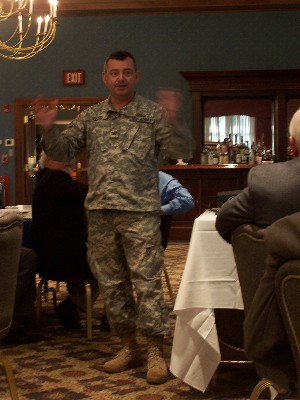 Col. Cris Boyd, USA, project manager, command posts, outlines the challenges of new fielding concepts during the October luncheon.