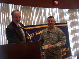 Col. Boyd (r) accepts a token of appreciation from Chuck Strimpler, chapter president, for speaking at the October meeting.