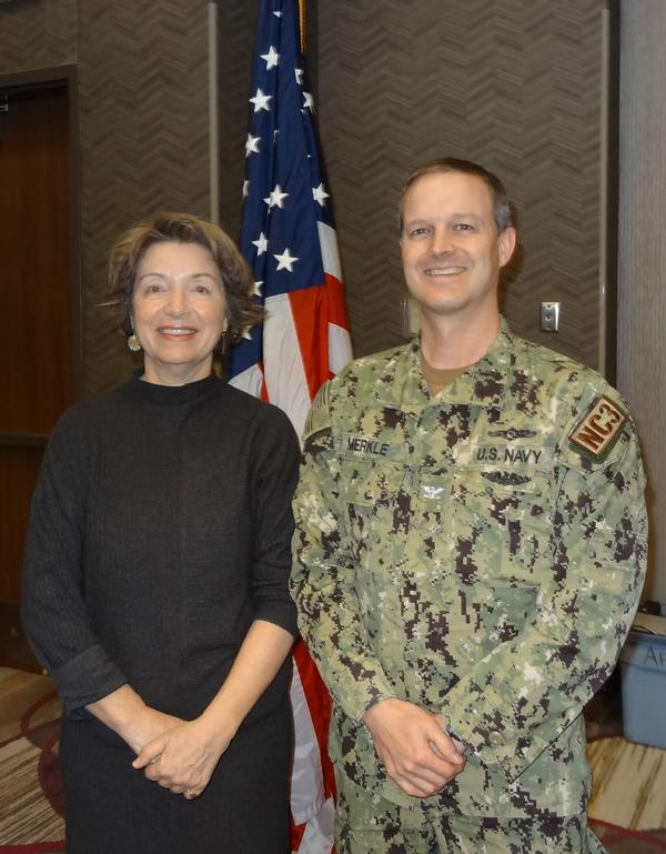 Silva Raker (l), inaugural CEO, Kiewit Luminarium, stands next to Capt. Thomas Merkle, USN, stand-in chapter president. Raker was the speaker for the January luncheon and received a Greater Omaha Chapter coin for addressing the chapter.