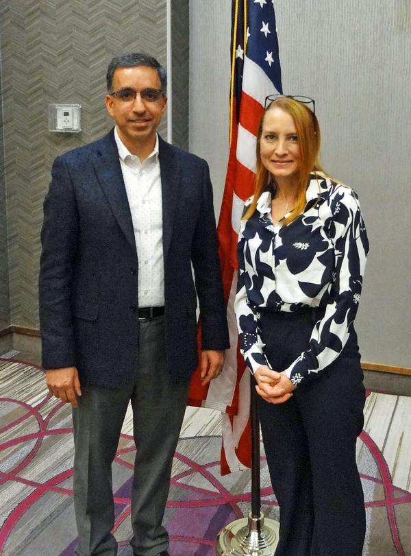 Rahul Jalali, senior vice president and chief information officer, Union Pacific Railroad, Omaha, Nebraska (l), poses with Janel Nelson, chapter president. Jalali was the speaker for the March Luncheon and received a Greater Omaha Chapter coin for addressing the chapter.