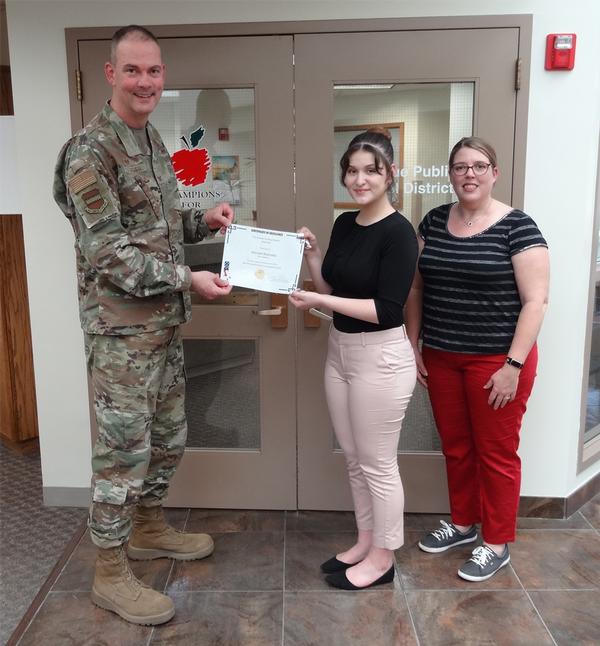 Pictured (from l-r) are Col. Larry Fletcher, USAF, chapter president; Hannah Reynolds, 12th grade, Zoo Academy, Omaha, Nebraska, Using Morphological Measurements; and Amy Leising, science teacher, OPS Career Center/Zoo Academy, Omaha, Nebraska. 
