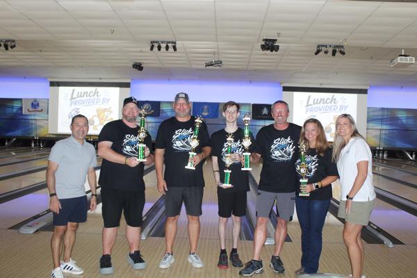 In July, tournament winners are joined by Col. Phil Alvarez, USAF, chapter president. 