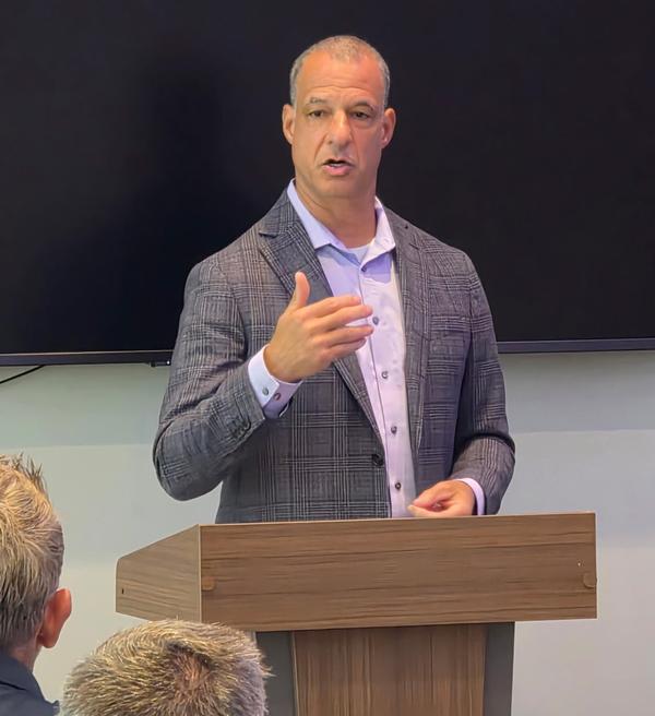 Pete Greany, program executive officer for services acquisition in the Center for Special Operations Forces Acquisition, Technology and Logistics at U.S. Special Operations Command, speaks at the chapter's June luncheon. 