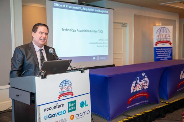 Jeffrey Neill discusses the Technology Acquisition Center's missions and strategic initiatives for FY 2025 at the October luncheon.