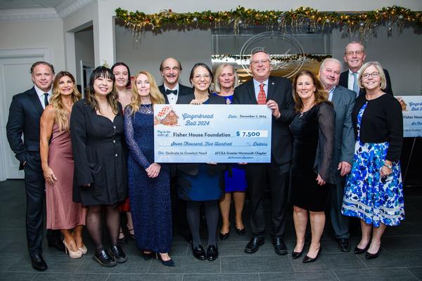 In December, chapter board members pose with the check donated to the Fisher House Foundation. Photo by Russ Meseroll