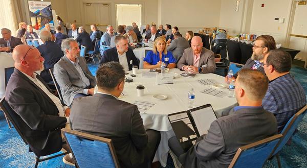 Zetta Solutions table meets with small and large companies to discuss capabilities in June.