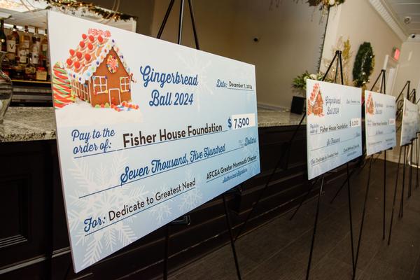 Pictured is the $7,500 check for the Fisher House Foundation presented at the Gingerbread Ball in December. Photo by Russ Meseroll