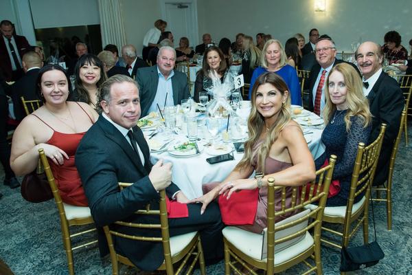 Chapter board members enjoy an evening of fine dining and live music at the December ball. Photo by Russ Meseroll