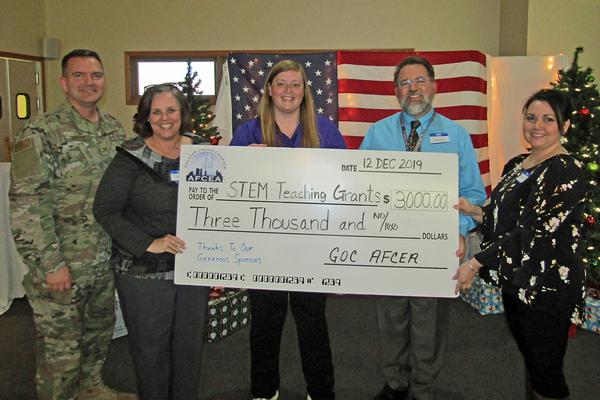 Col. Sean Murphy, USAF, chapter president, awards the grants to (l-r) Michelle Boyce, fifth grade Discovery Education STEM teacher leader, Fairview Elementary School, Bellevue Nebraska; Emily Salie, sixth grade teacher, Leonard Lawrence Elementary School, Bellevue Nebraska; Christopher Casart, eighth grade teacher, VEX IQ Competitive Robotics Team, Logan Fontenelle Middle School, Bellevue, Nebraska; and Diane Kremer, teacher and guest presenter, R.M. Marrs Magnet Middle School, Omaha, Nebraska. In December, the chapter awarded a total of $3,000 based on educators’ submissions for the STEM grants to bolster STEM programs in area schools.