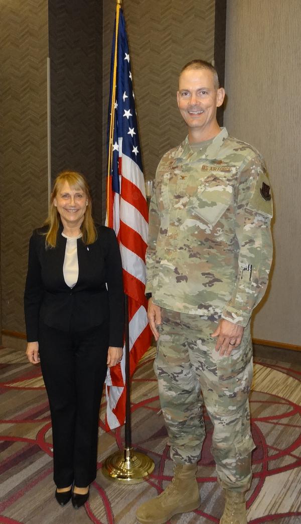 Elizabeth Durham-Ruiz (l), Senior Executive Services, director, Command, Control, Communications and Computer Systems and chief information officer, U.S. Strategic Command, Offutt Air Force Base, Nebraska, stands with Col. Larry Fletcher, USAF, chapter president.  Durham-Ruiz was the speaker for the October Luncheon and received a chapter coin for addressing the chapter.