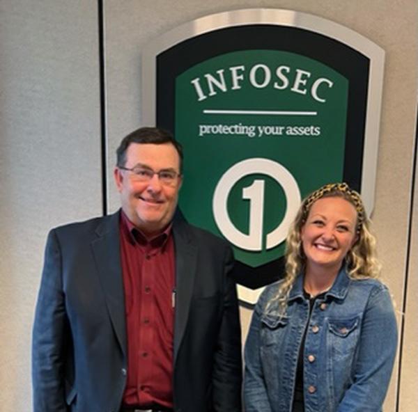 Jeffrey Weeks, senior vice president and chief information officer, First National of Nebraska, Omaha Nebraska, stands with Courtney Nichols, the chapter's lead Emerging Leader, in July after an Emerging Leaders Tech Tour (held in May).