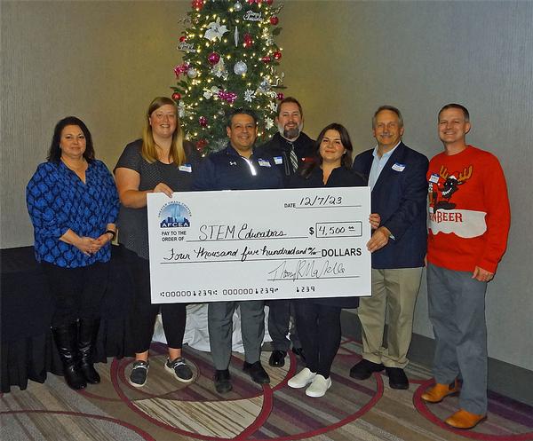 Pictured (l-r) are Diane Campbell, chapter vice president of academics; Emily Salie, sixth-grade teacher, Leonard Lawrence Elementary, Bellevue, Nebraska; Chad Zavala, principal, Leonard Lawrence Elementary; Alan Nesbitt, dean of students, Bryan High School, Omaha, Nebraska; Rachel Mulder, high school math teacher, Central High School, Omaha, Nebraska; Stephen Hamersky, high school science, computer science, computer security and robotics teacher, Daniel J. Gross Catholic High School, Bellevue, Nebraska; and Capt. Thomas Merkle, USN, chapter president. Standing in for award recipients Angela Daughtrey, eighth-grade math teacher, Mission Middle School, and Daniel Gudino-Garcia, high school math, computer science and robotics teacher, Bryan High School, are Zavala and Nesbitt, respectively. All educators received a stipend out of $4,500 based on their submissions for the Science Technology Engineering Mathematics (STEM) grants to bolster STEM learning in area schools. 