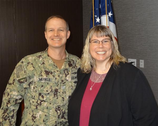 Capt. Thomas Merkle, USN (l), chapter president, poses with Lisa McKee, founding partner, American Security and Privacy, Dakota State University, Omaha, Nebraska. McKee was the speaker for the February luncheon and received a Greater Omaha Chapter coin for addressing the chapter.