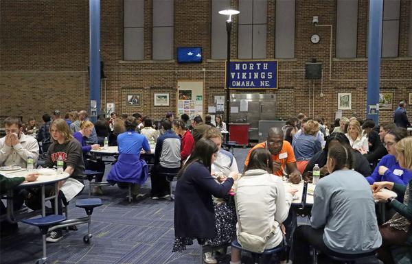 Scientists, teacher and student participants at the second Dinner with a Scientist event held at Omaha North High School assemble in February.  Directly after dinner, there were several demonstrations conducted to inspire students.  There were students and teachers from 12 area schools.