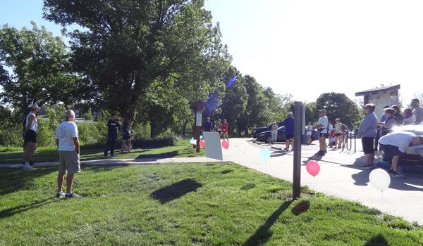 Thomas Merkle, chapter president (foreground), offers welcoming remarks for the Chapter's 8th Steps for STEM 5K in May.