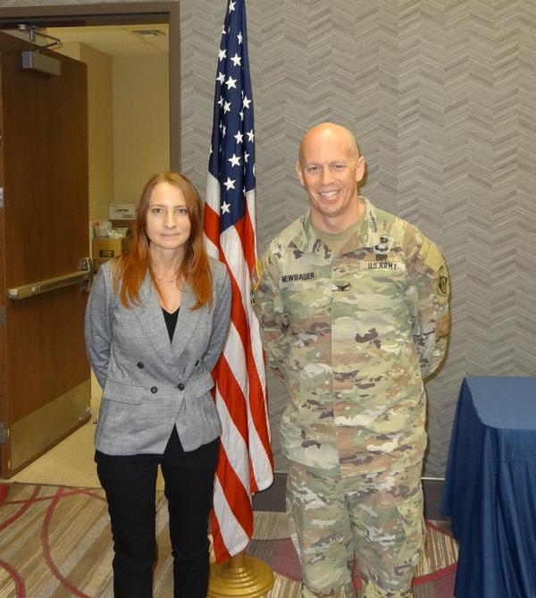 Janel Nelson, chapter executive vice president, poses with Col. Robert Newbauer, USA (r), commander, U.S. Army Corps of Engineers (USACE), Omaha District, Omaha, Nebraska. Newbauer was the speaker for the February luncheon and received a Greater Omaha Chapter coin for addressing the chapter. Additionally, Newbauer came prepared and provided Nelson with  the USACE coin with the buffalo logo 