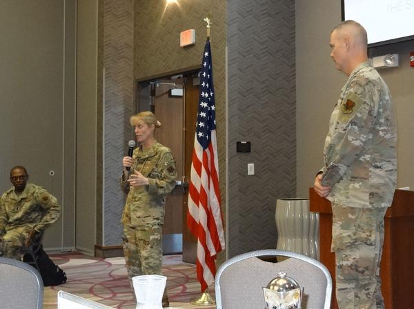 Col. Thompson addresses the chapter luncheon assembly at the August event.