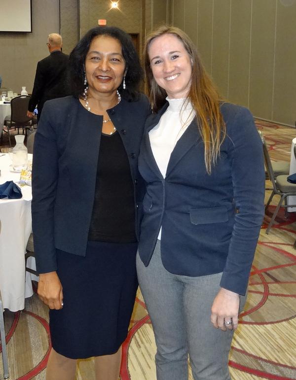 Qureshi poses next to Chloe Bauer, vice president of awards. Bauer became acquainted with Qureshi's work while attending classes at the University of Nebraska at Omaha.