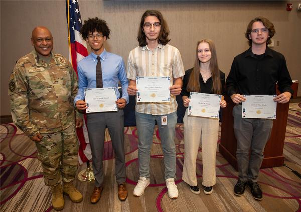Gen. Cotton poses for a photo with (l-r) Marcus Sherrod, attending Creighton University and studying neuroscience; Thor Hunziker, attending Hasting College and studying computer science; Rachel Wayne, attending the University of South Carolina and studying Chemical Engineering; and Carston Wiebe, attending the University of Nebraska Omaha and studying computer engineering. Gen. Cotton took time from his schedule to assist in the awarding of the Chapter's Spring Scholarships. 