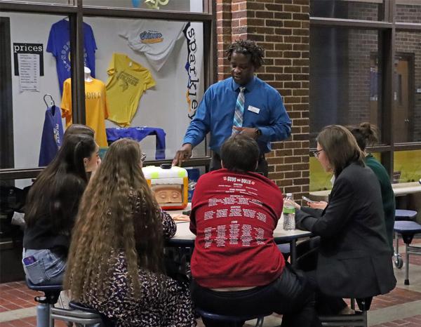 Derrick Nero, assistant professor, Graduate Secondary Education-STEM Concentration, University of Nebraska at Omaha, Omaha, keeps the students enthralled at his second Dinner with a Scientist event. The event entailed several demonstrations conducted by attending scientists to inspire student participants.