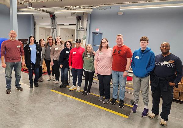 Pictured are the twelve chapter volunteers who supported the chapter's first Food Bank of the Heartlands work day outing in February. The team was charged with applying food labels to a prepackaged item, then replacing the items in boxes to be shipped out to food bank distributors. A fun time was had by all. This activity was put together by the chapter's vice president of Emerging Leader affairs, Ashlee Zimmerer.