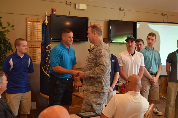 Master Sgt. Matthew Collingridge, USAF (r), TechNet Golf Tournament coordinator for the chapter, shakes hands with Col. Eric Bjurstrom, chapter president and commander, Defense Information Systems Agency Field Office at U.S. Strategic Command, Offutt Air Force Base.  Master Sgt. Collingridge was instrumental in putting together the AFCEA Heartland TechNet Golf Tournament, held in June at the Tregaron Golf Course, Bellevue, Nebraska.  Several vendors exhibited in conjunction with the golf tournament, including: Clearfield, Minneapolis; Hewlett-Packard, Palo Alto, California; Iron Bow Technologies, Chantilly, Virginia; Pivot3; Austin, Texas; STERLING Computers Corporation, Norfolk, Nebraska; and Wesco Communications Supply Corporation, Carol Stream, Illinois.  In addition, the tournament was co-hosted by the following sponsors: Commscope Incorporated, Hickory, North Carolina; CSC, Falls Church, Virginia; GEIST Global, Lincoln, Nebraska; Harris, Melbourne, Florida; Hewlett-Packard; Iron Bow Technologies; ITT Exelis Mission Systems, Colorado Springs, Colorado; Symantec, Mountain View, California; SES, Bellevue, Nebraska; STERLING Computers Corporation; and TEK Systems, Hanover, Maryland.