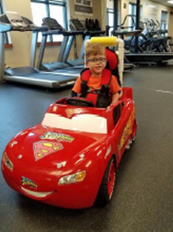 At the January meeting, Walls shows a modified electric car she developed as part of a Go Baby Go venture to help challenge the audio-sensory development of handicapped children before the age of five. 