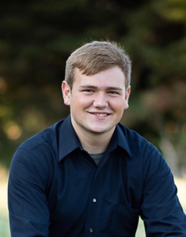 Ethan Roberts receives a chapter scholarship at the chapter's August event. He will attend University of Nebraska at Lincoln and will study mechanical engineering.