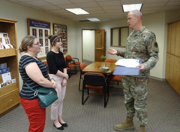 Reynolds (c) is accompanied by her science project mentor, Leising, for a special presentation in April made at the Bellevue Welcome Center to ensure she received her award. �
