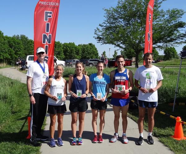 Col. Fletcher poses for a photo with (l-r) Robin Higley, Women's 3rd Place Finisher at 26:03; Erin Wetzstein, Women's 2nd Place Finisher at 18:40 and Women's 1st Place Finisher at 17:47; Andy Vasquez, Men's 2nd Place Finisher at 15:52 and Men's 1st Place Finisher at 15:33. The STEM 5K was held in May at Walnut Creek Park. This was the chapter's sixth occurrence of this event. Monetary awards were sponsored by M2TI.