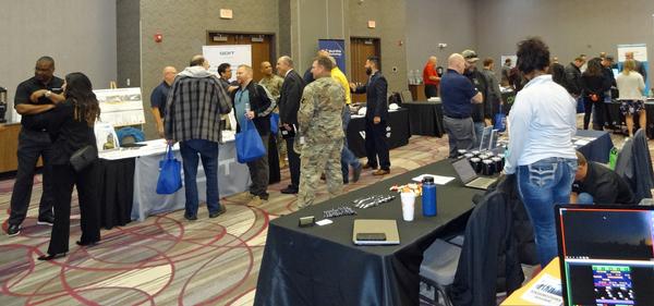 Attendees participate in the October Technology Exposition held coincidentally with the October Luncheon.