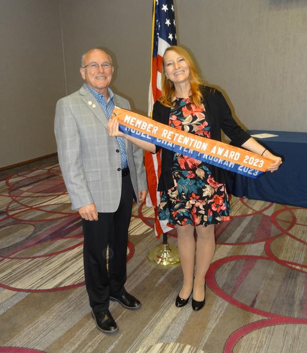 Varner poses with Nelson at the June luncheon.