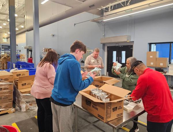 Volunteers show some love at the February Food Bank of the Heartlands event.