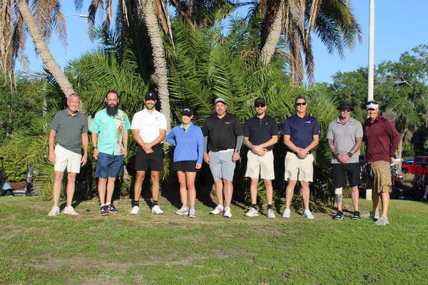 Representatives of tournament sponsors pause for a photo opportunity at the May golf fundraiser.
