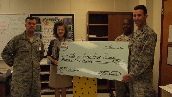 At the chapter's November STEM grant presentation to Biloxi Junior High School are (l-r) Senior Master Sgt. Jason Holbert, USAF, chapter vice president of scholarships; Patty Comer, science teacher; Capt. Adrian Wright, USAF, chapter vice president; and Capt. Glen Lewis, USAF, chapter president.