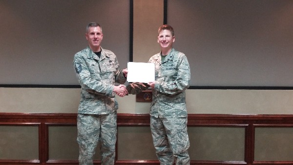 Chapter President Master Sgt. David Way (l), USAF, 338 Training Squadron, presents a certificate of appreciation to Col. Huston after his presentation at the chapter's March luncheon.