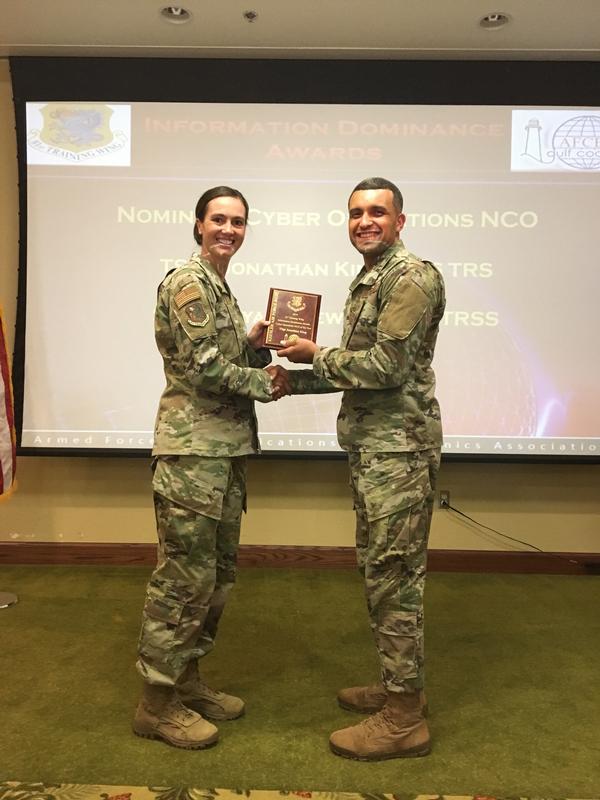 Blackwell presents an Information Dominance Award to Technical Sgt. Jonathan King, USAF, at the October luncheon. 