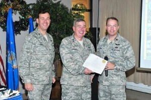 Maj. Gen. Paul F. Capasso, USAF (c), director, Command, Control, Communications and Computer Systems, U.S. Africa Command, Stuttgart, Germany, receives a certificate commemorating a donation made to Keesler Air Force Base's Fisher House in his honor from Brig. Gen. Gregory J. Touhill, USAF (l), 81st Training Wing, and Lt. Col. Scott E. Solomon, USAF, 333rd Training Wing, and chapter president.