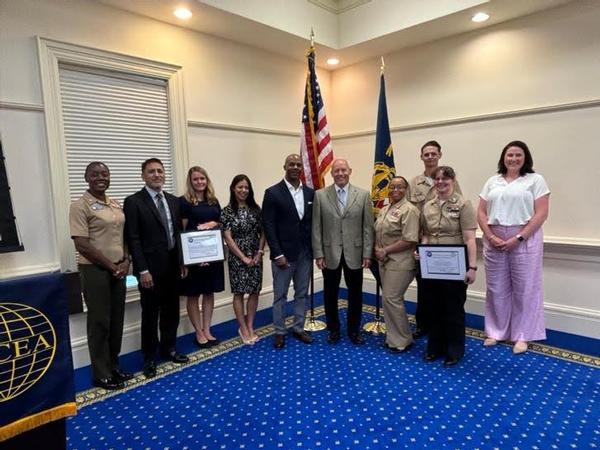 Francis "Skip" Hiser III, director of communications and information systems for U.S. Fleet Forces Command (USFFC) in Norfolk, Virginia, stands with his USFFC N6 Team, award winners and Chapter President Caitlin Johnson at the July event.