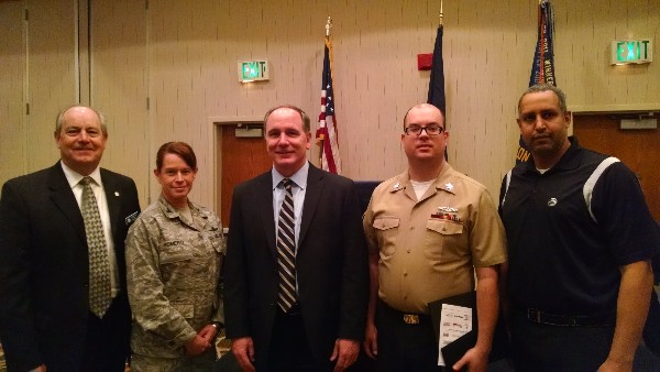 Attendees at the March luncheon are (l-r) Chapter President Palmer Sims; Col. Jenniffer Romero, USAF, chief, Cyberspace Environment Division (JIOR) at Joint Staff J7; Col. David Olszowy, USMC (Ret.), deputy chief information officer, Military Sealift Command; John McKenna, COMSUBLANT; and new AFCEA Life Member Arthur Hernandez.