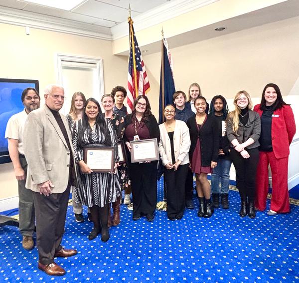 Chapter Vice President  of Education Dennis Garcia (l), and Chapter President Caitlin Johnson (r), stand with the STTA Program winners and their students in January.
